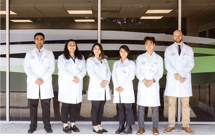 Anderson Hospital Emergency Residency team. 6 doctors in lab coats. 3 present male, 3 present female.