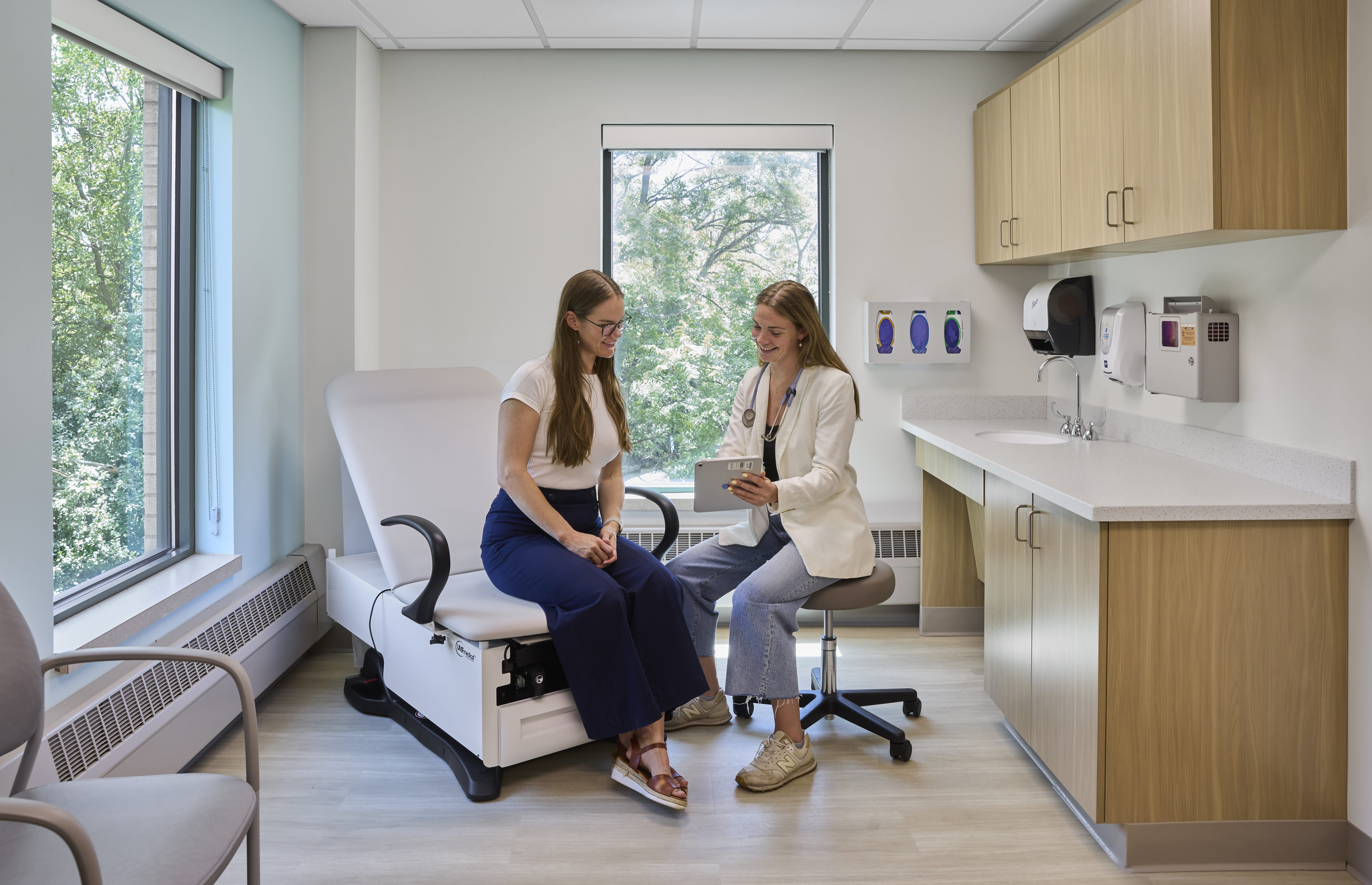 female physician at Mercy Health — Fallen Timbers Cardiology reviews chart with patient