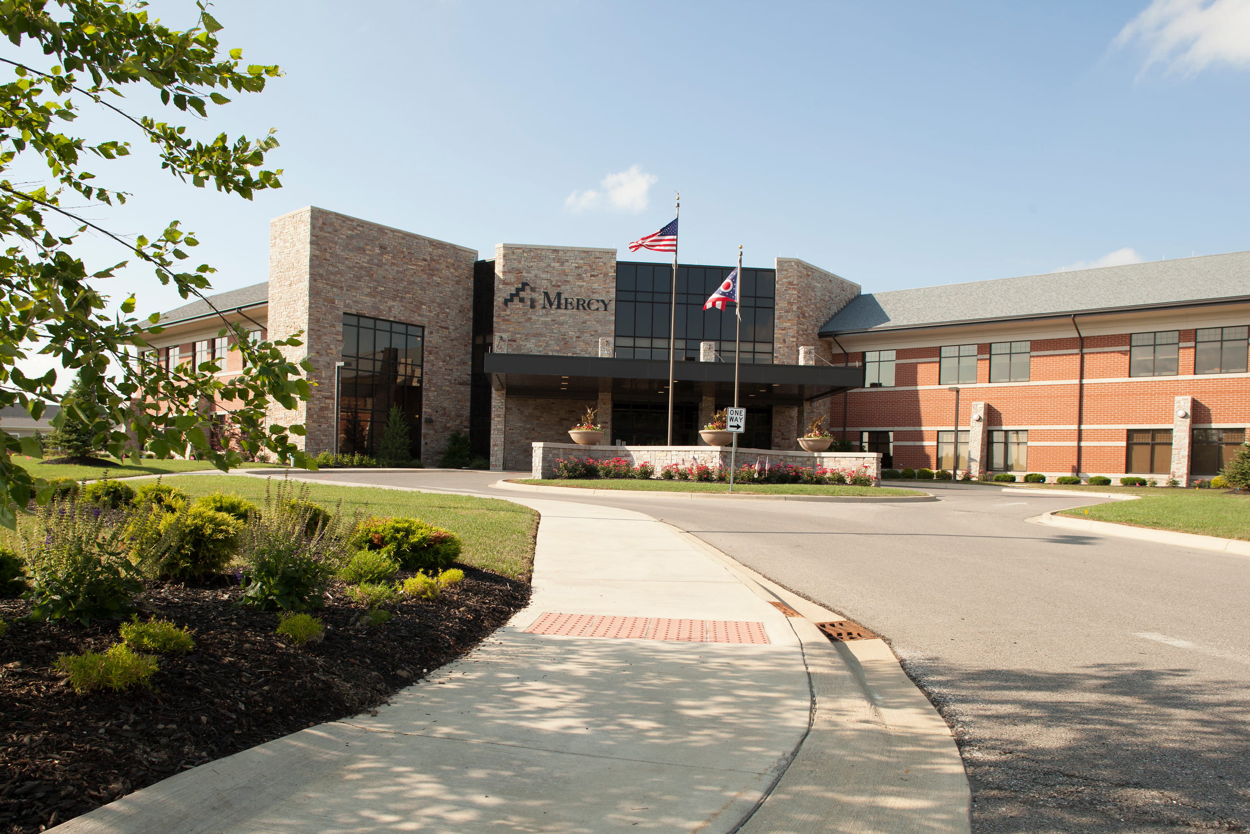 Willard Hospital exterior of driveway and main entrance with passenger  loading area.